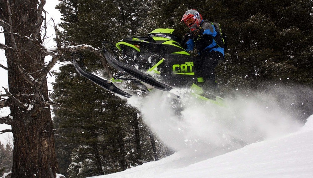 When taking on large deadfall trees, the new domestic built motor from Arctic Cat digs deep and low with mountainous grunt to launch the Mountain Cat up over the large obstacles.