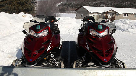 Redline Snowmobiles on Trailer