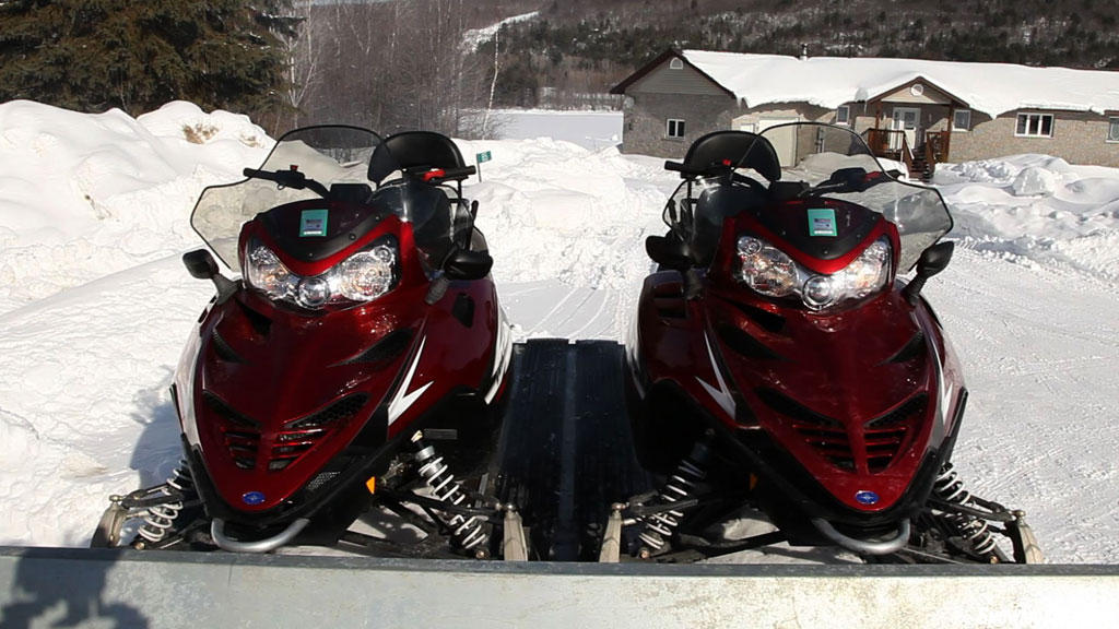 Redline Snowmobiles on Trailer