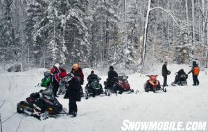 Ontario Snowmobilers Checking Mobile Trail Guide