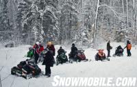 Ontario Snowmobilers Checking Mobile Trail Guide