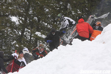 Chris Burandt and his snowmobile inadvertently dive into the crowd that stood on the side lines.